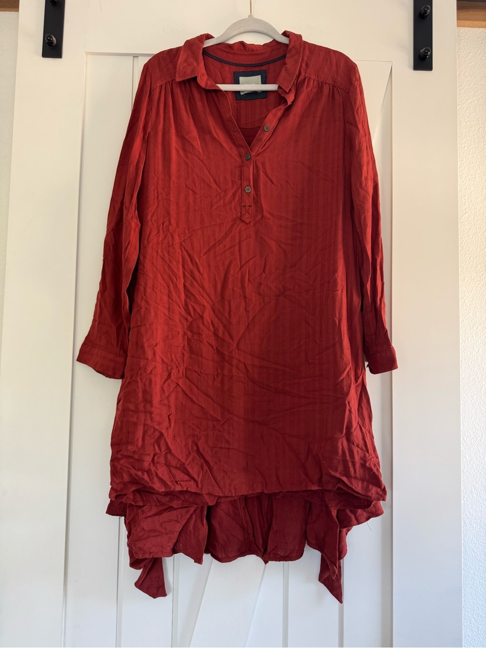 Maeve for Anthropologie Henley long-sleeve dress featuring a flared, uneven hem.